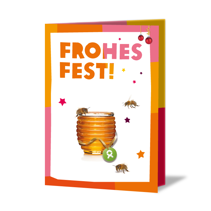 Weihnachtskarte mit Aufschrift: Frohes Fest. Umrandet von Weihnachtsdeko fliegen drei Bienen um ein Honigglas herum